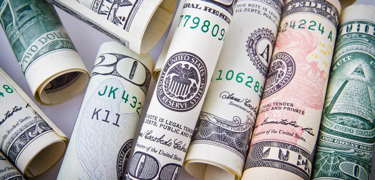 Bills rolled up by one another.