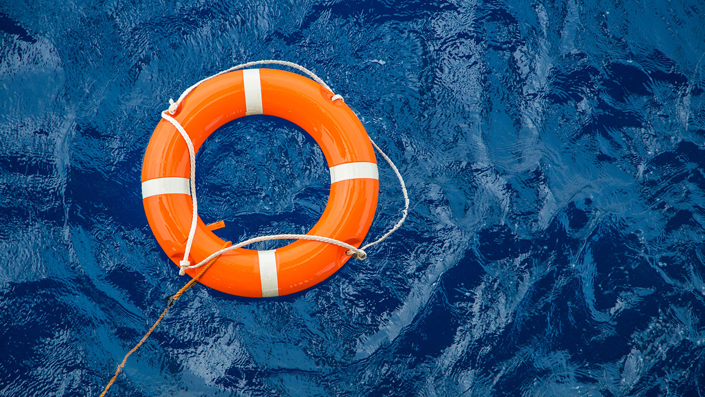 Orange rescue floater in the water.
